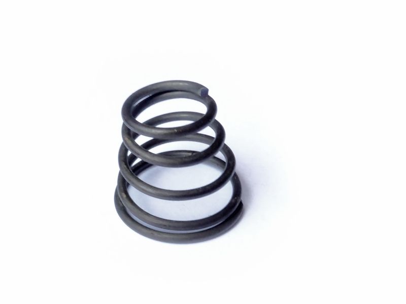 Thrust spring for breather ring on camshaft