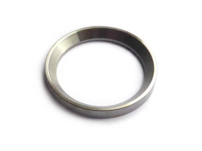 Spacer ring for oil slinger with chamfer